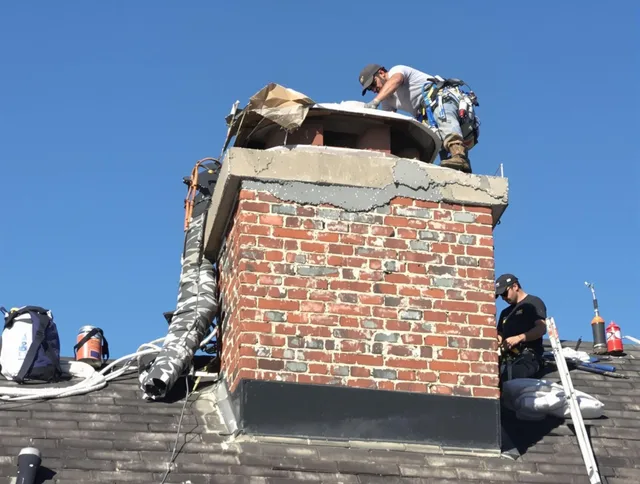Boca Raton Chimney Sweep installing a custom chimney crown in Boca Raton, FL